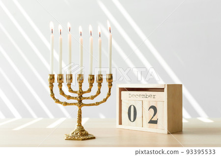 Bronze Hanukkah menorah with burning candles Bronze Hanukkah menorah with burning candles 93395533