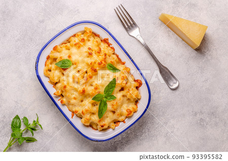 American mac and cheese, macaroni pasta in cheesy sauce American mac and cheese, macaroni pasta in cheesy sauce 93395582