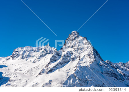 High snowy mountain peak in Dombai in Russia 93395844