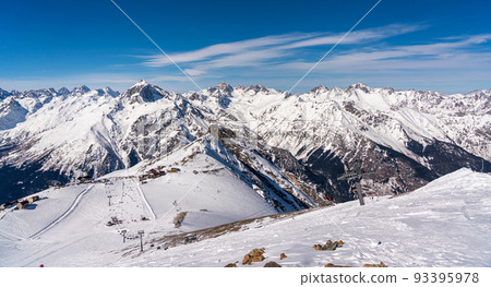 Panorama of winter snowy mountains in Caucasus region in Russia with ski lift and ski track Panorama of winter snowy mountains in Caucasus region in Russia with ski lift and ski track 93395978