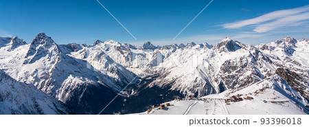 Panorama of winter snowy mountains in Caucasus region in Russia with ski lift and ski track Panorama of winter snowy mountains in Caucasus region in Russia with ski lift and ski track 93396018