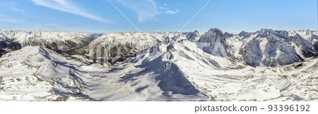 view of the mountains in the snow from a height  93396192