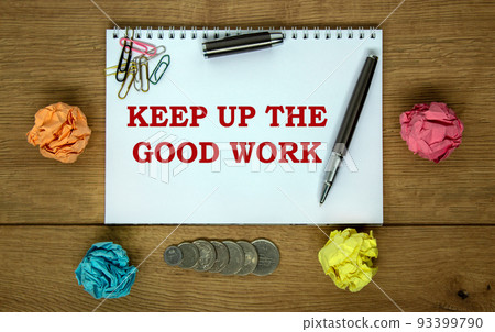 White note with inscription 'keep up the good work' on beautiful wooden table, colored paper, metalic pen. Business concept. 93399790