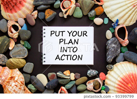 Put your plan into action symbol. Concept words Put your plan into action on beautiful black background. Sea stones and seashells. Busines planning and put your plan into action concept. Copy space. Put your plan into action symbol. Concept words Put your plan into action on beautiful black background. Sea stones and seashells. Busines planning and put your plan into action concept. Copy space. 93399799