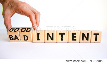 Good or bad intent symbol. Businessman turns wooden cubes and changes words 'bad intent' to 'good intent'. Beautiful white table, white background. Business, bad or good intent concept. Copy space. Good or bad intent symbol. Businessman turns wooden cubes and changes words 'bad intent' to 'good intent'. Beautiful white table, white background. Business, bad or good intent concept. Copy space. 93399853