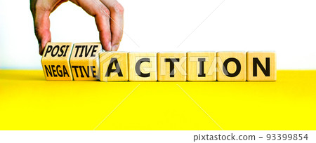 Positive or negative action symbol. Businessman turns cubes and changes words negative action to positive action. Beautiful white background, copy space. Business positive or negative action concept. Positive or negative action symbol. Businessman turns cubes and changes words negative action to positive action. Beautiful white background, copy space. Business positive or negative action concept. 93399854