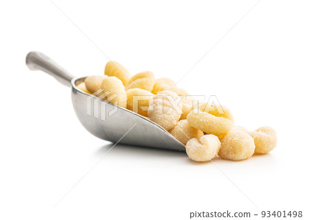 Uncooked potato gnocchi in scoop isolated on white background. Uncooked potato gnocchi in scoop isolated on white background. 93401498