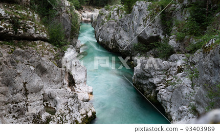Beautiful green river of soca with white morning mist above it Beautiful green river of soca with white morning mist above it 93403989