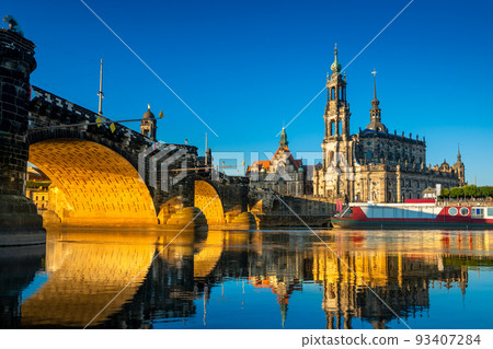Augustus Bridge and Cathedral of the Holy Trinity with reflections in the river Elbe. Dresden, Saxony, Germany 93407284