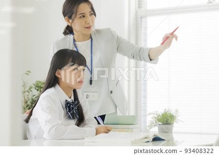 Female students taking classes at cram school Junior high school high school students 93408322
