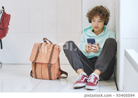 Depressed Teen in School 93408894