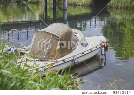 Old worn out motorboat in Christiania Copenhagen. Denmark Old worn out motorboat in Christiania Copenhagen. Denmark 93410114