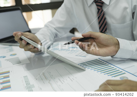 Close up asisan businessman teamwork meeting and discussing the investment data and report graph. 93414202