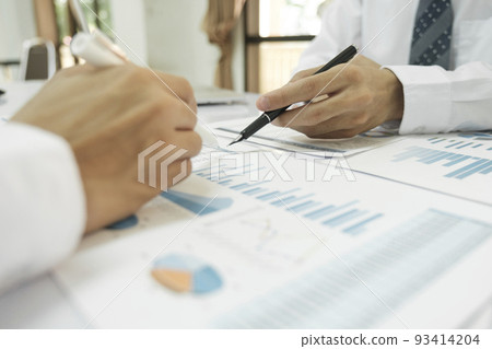 Asisan businessman teamwork meeting and discussing the investment data and report graph. Asisan businessman teamwork meeting and discussing the investment data and report graph. 93414204
