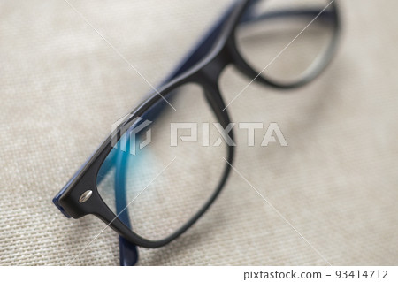 Reading spectacles, fashionable eyeglasses isolated on blurred white copy space background. Reading spectacles, fashionable eyeglasses isolated on blurred white copy space background. 93414712