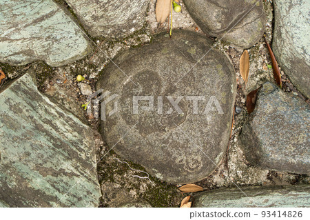 Stone pavement carved in the shape of an apple Stone pavement carved in the shape of an apple 93414826