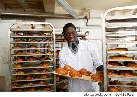 African-american lay out over trolley fresh pastries African-american lay out over trolley fresh pastries 93415922