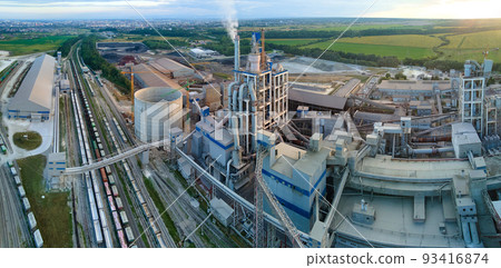 Aerial view of cement factory with high concrete plant structure and tower crane at industrial production site. Manufacture and global industry concept. 93416874