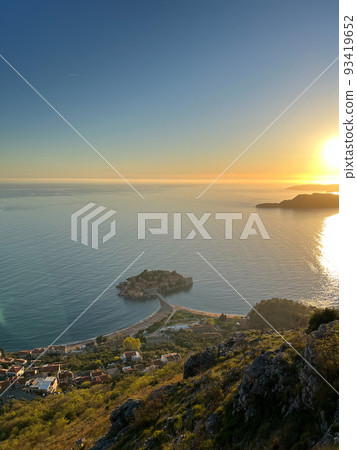 View from the mountain to the Sveti Stefan island at sunset View from the mountain to the Sveti Stefan island at sunset 93419652