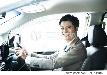 Male car driving looking at the camera smiling 93419860