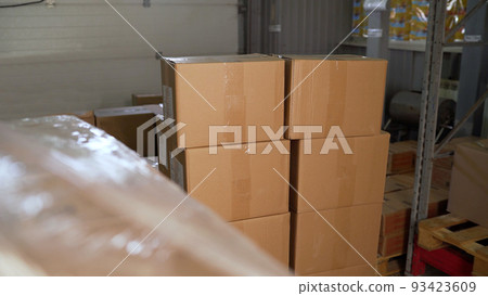 Warehouse interior, packing boxes stacking. rack stack Arrangement of cardboard boxes in a store warehouse. Cardboard boxes available, delivery. Warehouse interior, packing boxes stacking. rack stack Arrangement of cardboard boxes in a store warehouse. Cardboard boxes available, delivery. 93423609