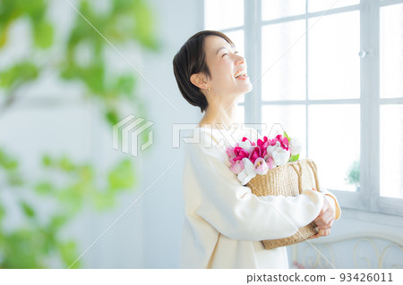 Woman with tulips 93426011