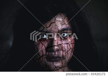 Close up of horror bloodthirsty ghost female with fade drop out from eyes Close up of horror bloodthirsty ghost female with fade drop out from eyes 93426172