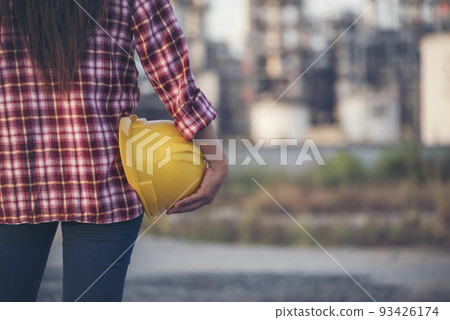 Woman construction engineer wear safety white hard hat at construction site industry worker. Female engineer worker civil engineering with hard hat safety helmet. Woman construction Engineer concept 93426174