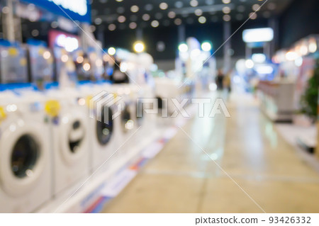Washing machines in home appliance electronic department retail store blur background 93426332