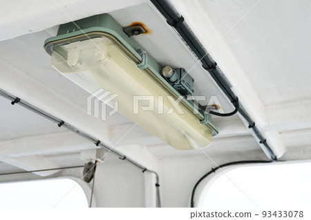 Old fluorescent light on a passenger ship 93433078