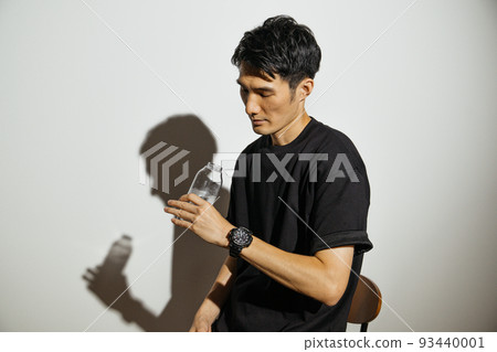 Men drinking water in sports fashion Men drinking water in sports fashion 93440001