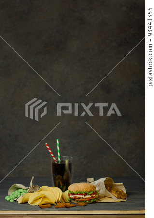 Drinks in a paper cup with a paper tube and hamburger Drinks in a paper cup with a paper tube and hamburger 93441355