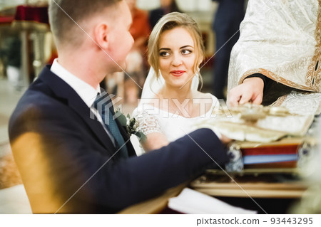 Wedding couple bide and groom get married in a church 93443295