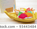 Menu table and sashimi miniatures in a restaurant 93443484