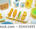 Miniature izakaya interior and various food miniatures with 4 skewers of yakitori 93443495