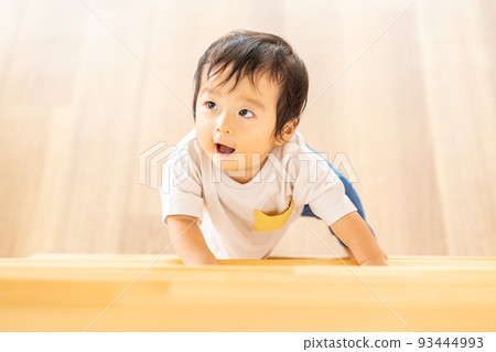 infant trying to climb stairs infant trying to climb stairs 93444993