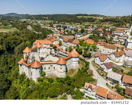 Aerial drone view of Medieval castle of Zuzemberk or Seisenburg or Sosenberch, positioned on terrace above the Krka River Canyon, Central Slovenia. Aerial drone view of Medieval castle of Zuzemberk or Seisenburg or Sosenberch, positioned on terrace above the Krka River Canyon, Central Slovenia. 93445252