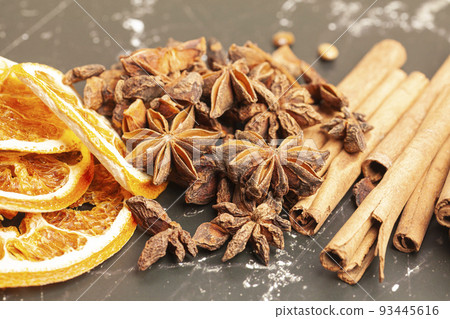 Cinnamon sticks,dried oranges and anise star Cinnamon sticks,dried oranges and anise star 93445616