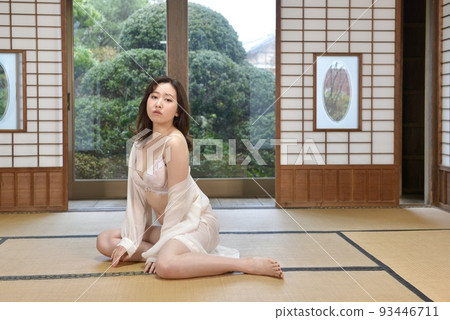 A young woman wearing white lingerie sitting in a Japanese-style room in an old folk house A young woman wearing white lingerie sitting in a Japanese-style room in an old folk house 93446711