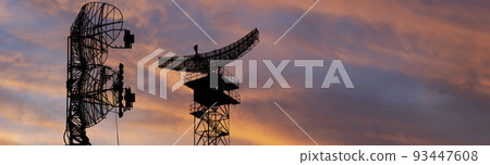 Air defense radars of military mobile anti aircraft systems, modern army industry on the background of the sunset orange sky, Russia 93447608