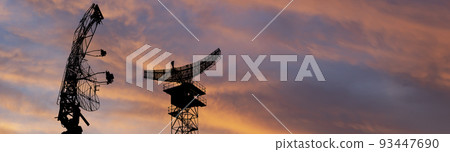 Air defense radars of military mobile anti aircraft systems, modern army industry on the background of the sunset orange sky, Russia 93447690