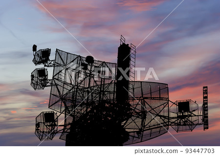 Air defense radars of military mobile anti aircraft systems, modern army industry on the background of the sunset orange sky, Russia 93447703