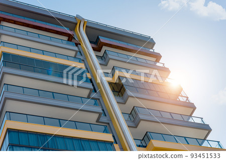 Part of a modern residential building with large balconies. Part of a modern residential building with large balconies. 93451533