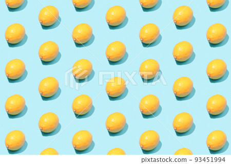 Summer background of yellow lemons on a mint table. 93451994
