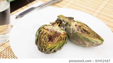 cooked fried halves artichokes on white plate cooked fried halves artichokes on white plate 93452487