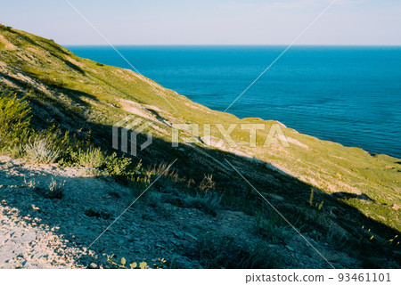 View of steep green rocky slope 93461101