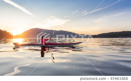 Adventurous Woman on Sea Kayak paddling in the Pacific Ocean. Adventurous Woman on Sea Kayak paddling in the Pacific Ocean. 93461868