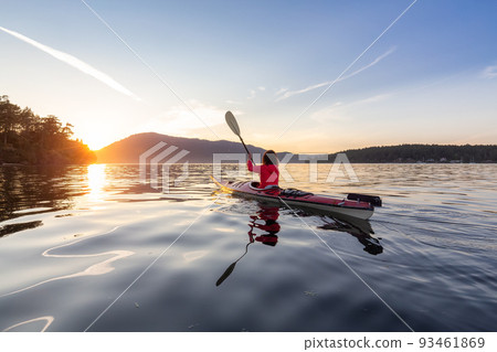 Adventurous Woman on Sea Kayak paddling in the Pacific Ocean. 93461869