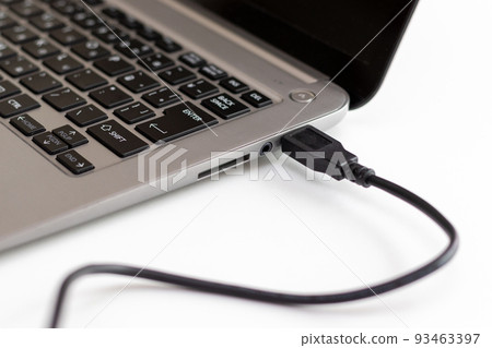 USB cable connected to laptop 93463397