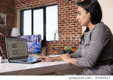 Financial broker working with stock market diagrams, looking at real time stattistics trend with forex exchange profit and rate. Analyzing hedge fund index for global money investment on laptop. Financial broker working with stock market diagrams, looking at real time stattistics trend with forex exchange profit and rate. Analyzing hedge fund index for global money investment on laptop. 93464427